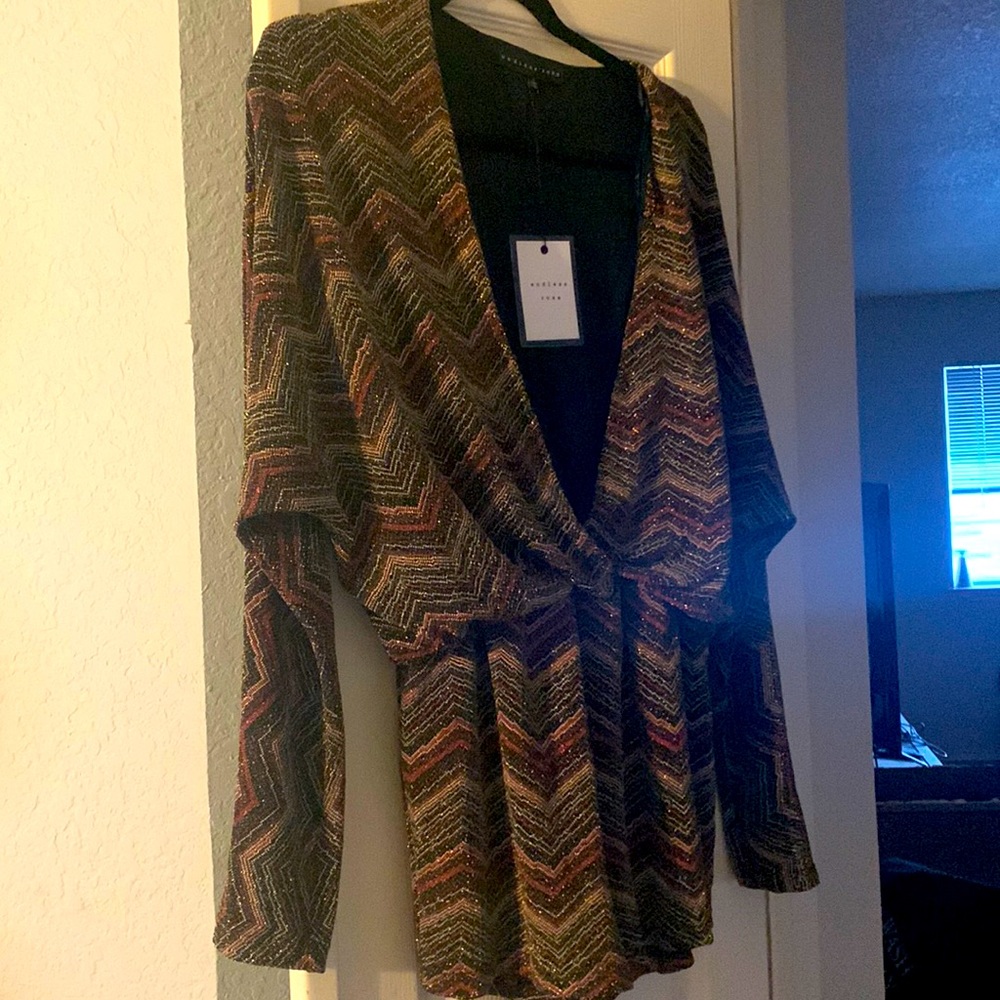 Multi color romper fits like a medium 8/10